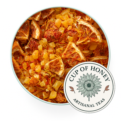 Bright tropical mango herbal tea with pineapple, citrus, and floral petals, a sweet fruit‑forward loose‑leaf blend from Sip of Honey 